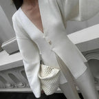 V-Neck, Buckle Closure, and Slit Detail